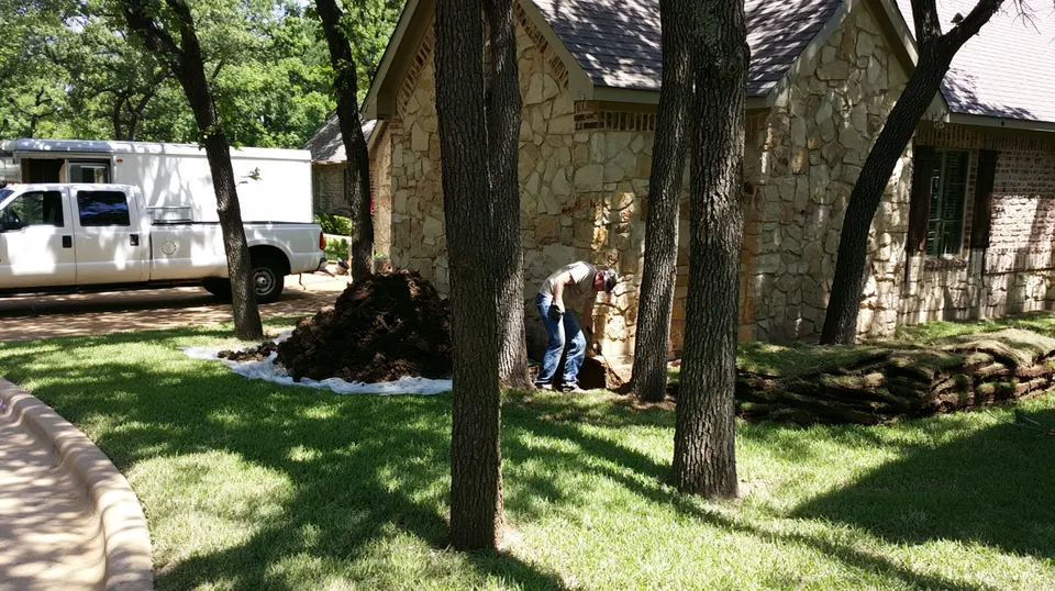 A technician checking floor elevations inside a brick home in Fairview during a foundation repair inspection booked through McKinney.